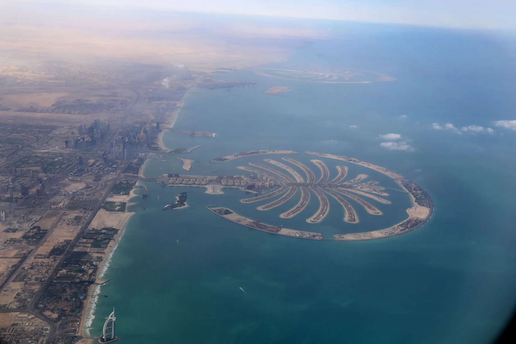 Aerial photograph of Palm Jumeirah showing its trunk, fronds and crescent