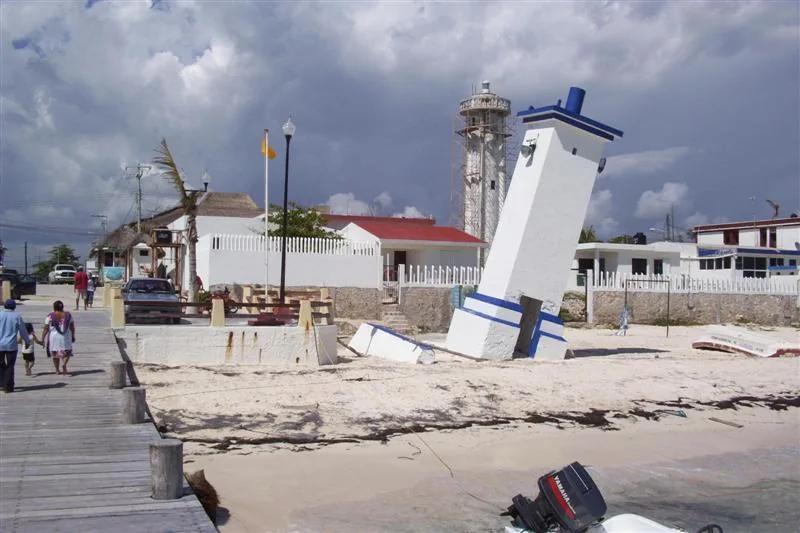 The Original Lighthouse at Puerto Morelos, Mexico in Feb. 2007. In 1967 the structure was tilted over in Hurricane Beulah. It has since survived Hurricanes Gilbert in 1988 and Wilma in 2005, but has not been knocked down. The new light house replacing this one is visable in the background.
Author : Laurie Button
Own work, all rights released.